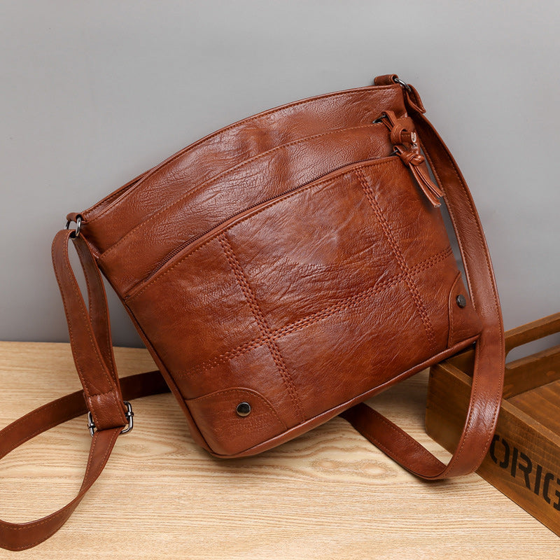 Zacht lederen schoudertas met meerdere vakken en grote capaciteit